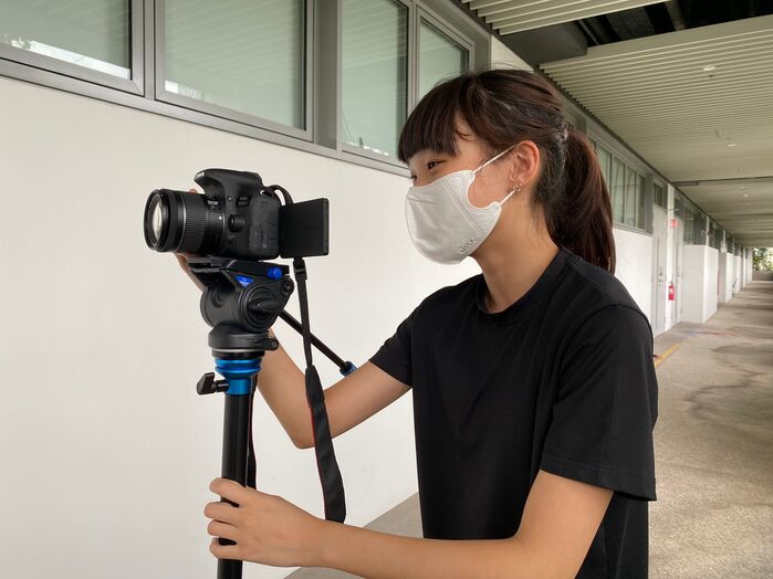 me (rae) operating a camera_ 2022, during film class